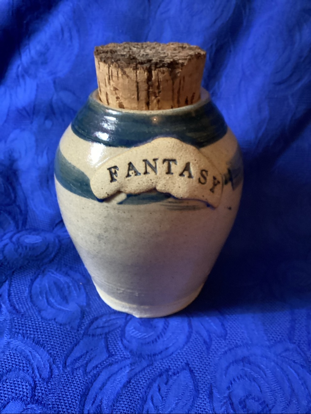 Vintage Small Stoneware Jar (signed) with Cork. A  rabbit and message inside.